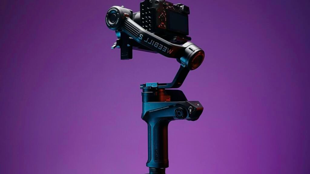 A new tripod for shooting. Action. A great accessory for professional filming shot on a purple blank